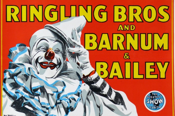 Colorful vintage circus poster with a clown and bold, large text.